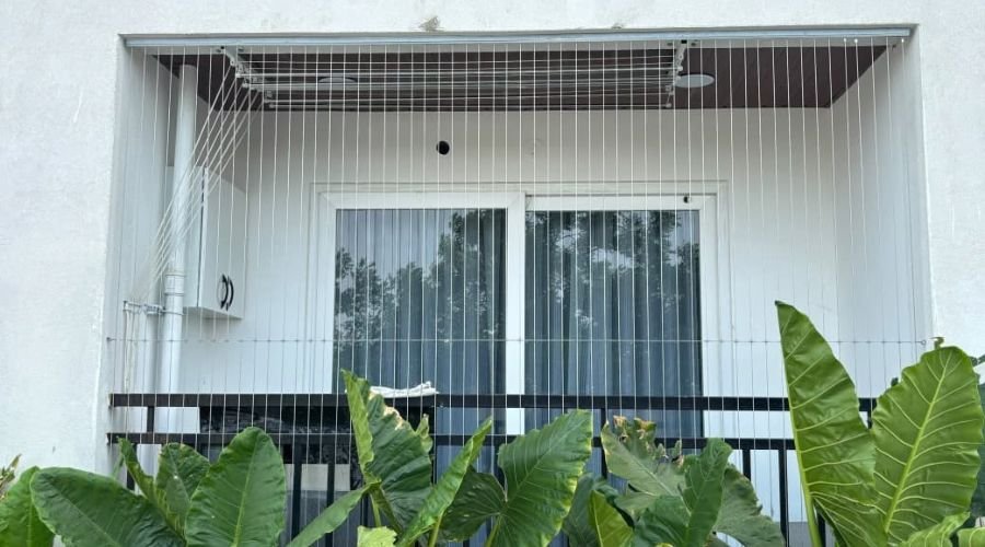 Stainless steel invisible grill for windows showcasing clear view and safety by Hasini Safety Nets